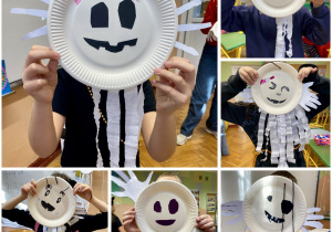 Uczniowie prezentujący wykonaną pracę plastyczną