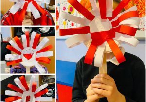 dzieci prezentują pracę plastyczną - kwiat w barwach narodowych